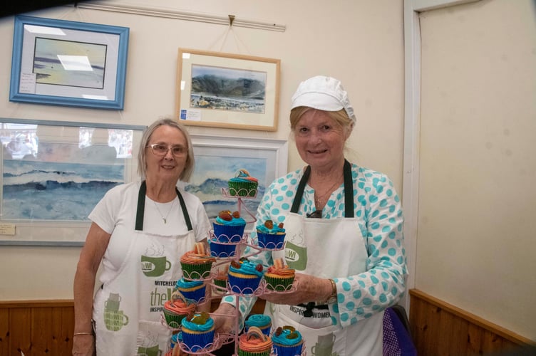 Nora Powell and Pat Nixon on the Mitcheldean WI cake stall.