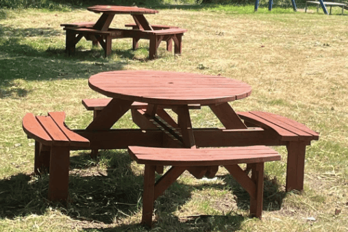 Refurbished round picnic benches are ready to welcome families and visitors to Sling Playing Fields during the school holidays.