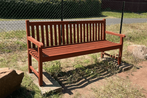 A park bench at Sling Playing Fields after being sanded and treated by volunteers ahead of the summer holidays.