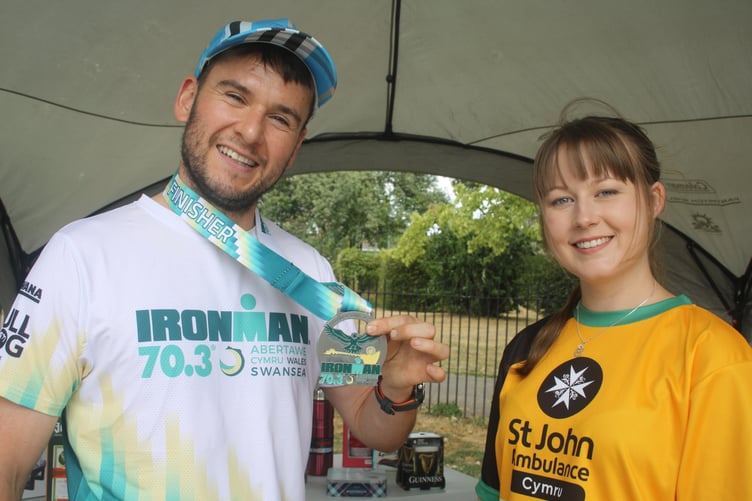 Matthew Biddle who competes in Ironman events and his partneer Megan James fund-raising for St John Ambulance.