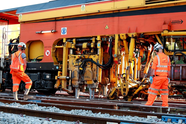 Engineers carrying out tamping work as part of essential track maintenance to help keep the railway running safely and reliably.