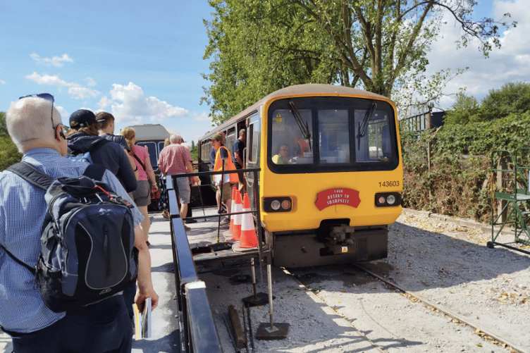 Passengers board one of the Vale of Berkeley Railway's inaugural heritage services at Sharpness during celebrations marking the 150th anniversary of the first passenger trains to the town.