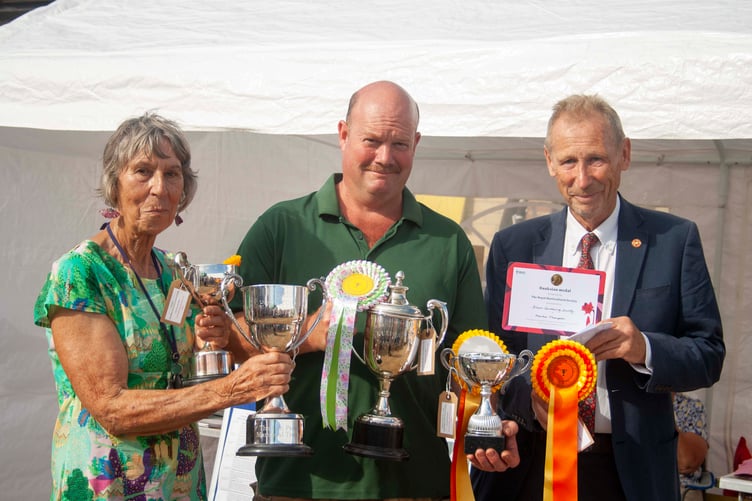 Martin Thompson won six cups in the horticulltural section. He is pictured with show president Diana Stnding and Vice Lord Lieutenant of Gloucestershire Roger Deeks.