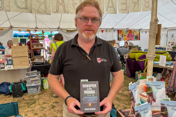 Lydney poet Stan Rudge with his collection of poems Whisper in the Woods.