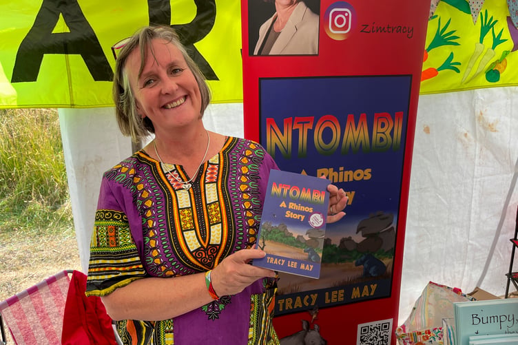 Tracy Lee May with her book Ntombi