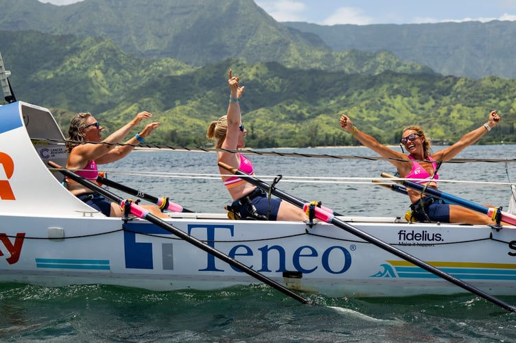 Felicity, right, raises her arms in joy as they cross the line at the end of their epic Pacific row