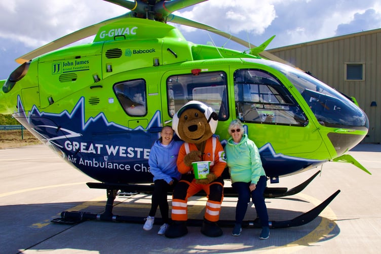 GWAAC volunteers with the Charlie Bear mascot and helicopter