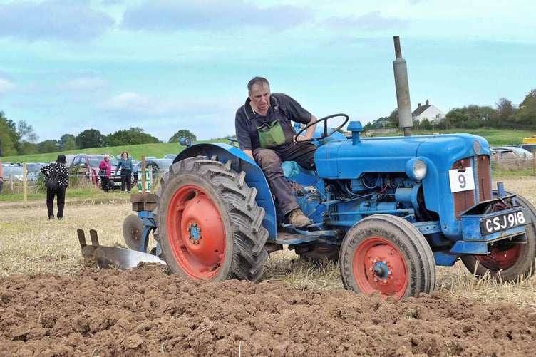 Andy Green ploughs with his dad's, Ted Green, tractor and plough