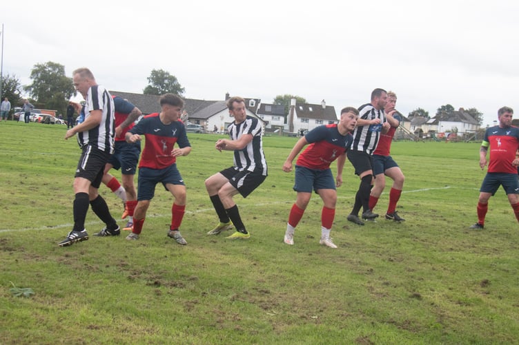 Lydbrook (in stripes) open the scoring.