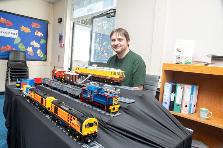 Ralph Tittensor with trains made of Lego.