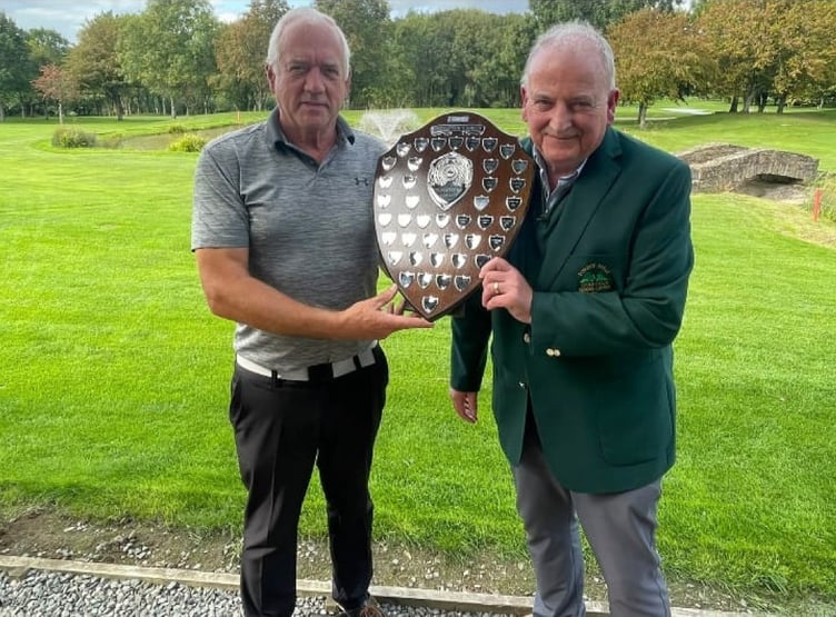Cliff Hill (left) accepts The Captain's Shield from Seniors Captain Kev Doyle
