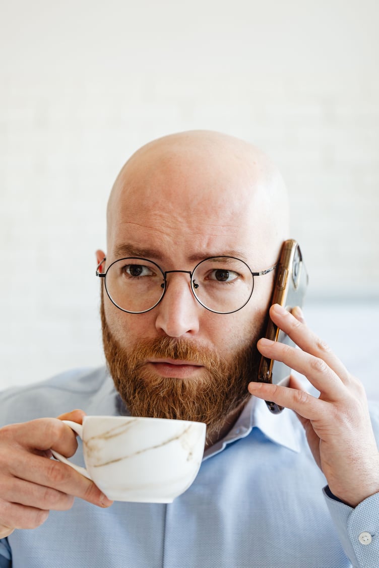 Bald guy with coffee