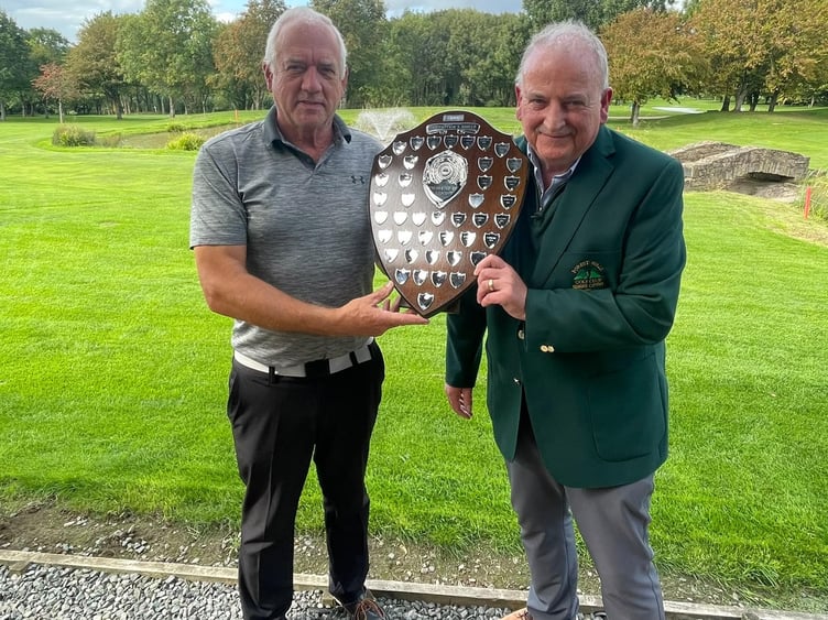 Cliff Hill (left) accepts the Captain's Shield from Seniors' Captain Kev Doyle.