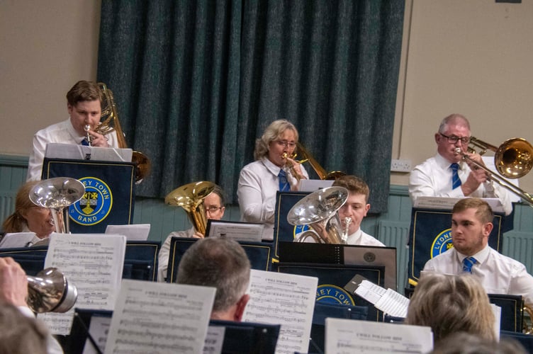 Trombone ensemble Adrian Bollen, Julie Jones and Matthew Crowe playing I Will Follow Him.