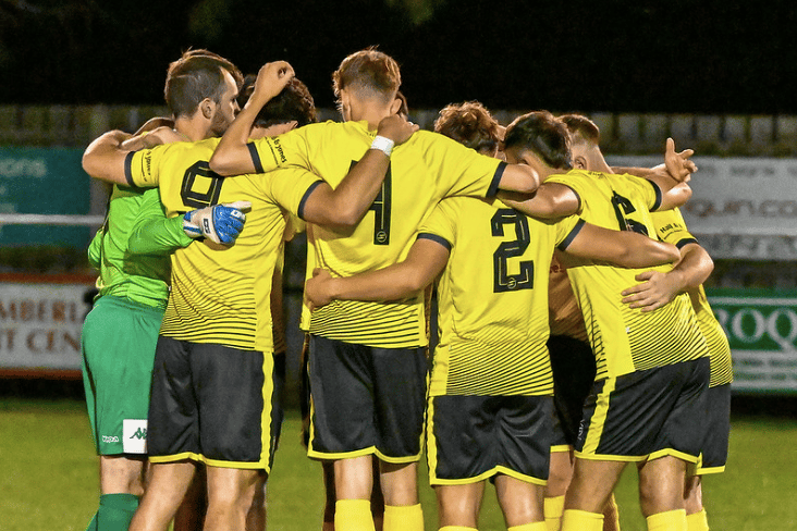 Newent Town rescued a point deep into stoppage time after a thrilling 3-3 draw against Sharpness.